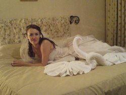 Brunette bride in sexy lingerie on her wedding night