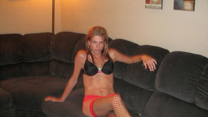 Trashy cheating MILF in sexy lingerie on the sofa