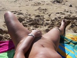 MILF masturbating on the nudist beach