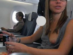 Older wife flashes her tits in the airplane