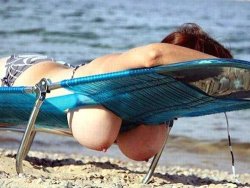 Mature wife with huge tits on the beach